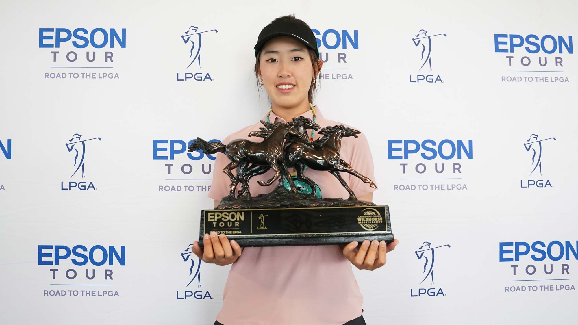 Xiaowen Yin poses with the trophy after winning the 2023 Wildhorse Ladies Golf Classic