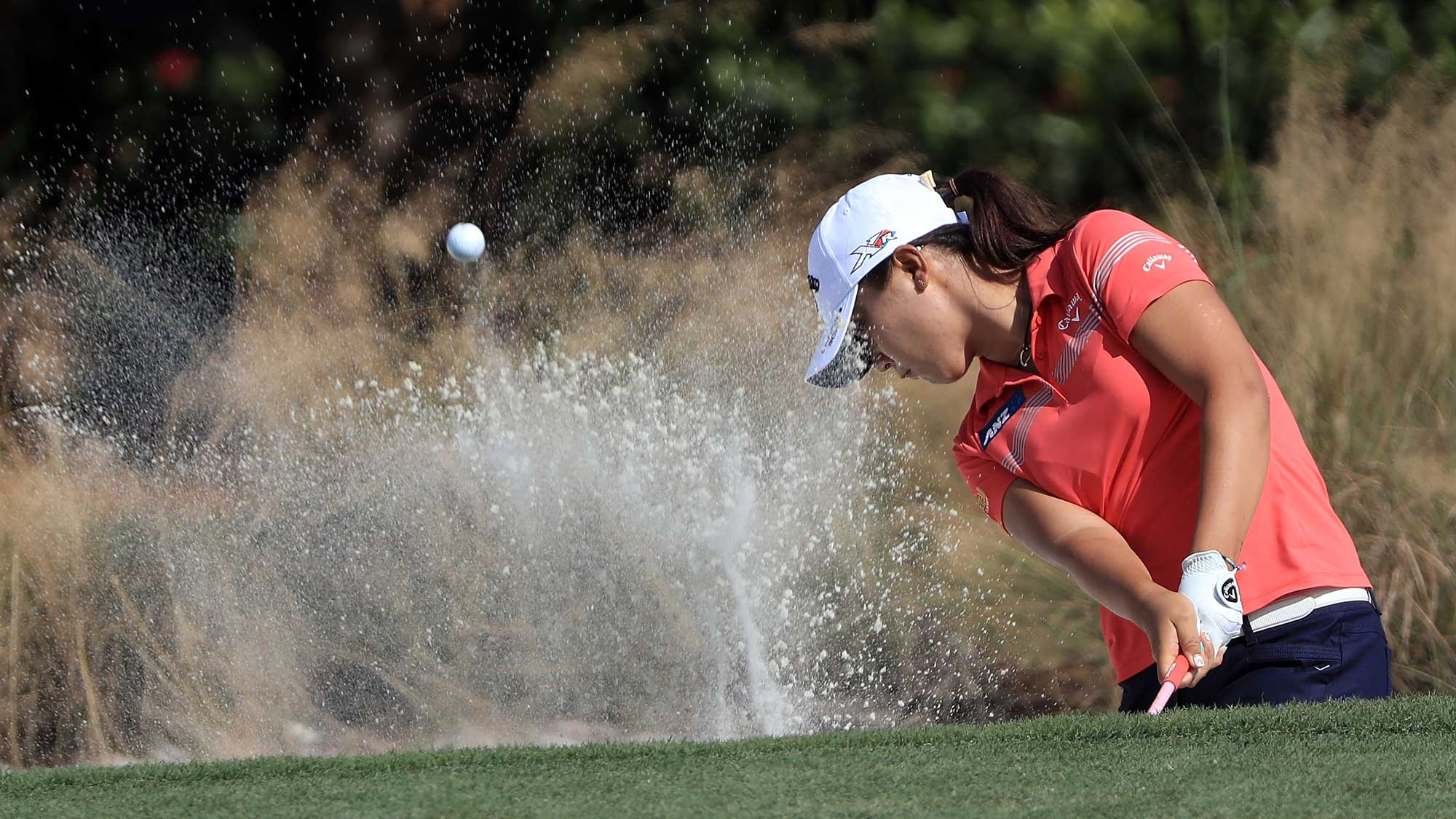 Lydia Ko of New Zealand plays her shot out of the bunker on the sixth hole during the third round of the CME Group Tour Championship