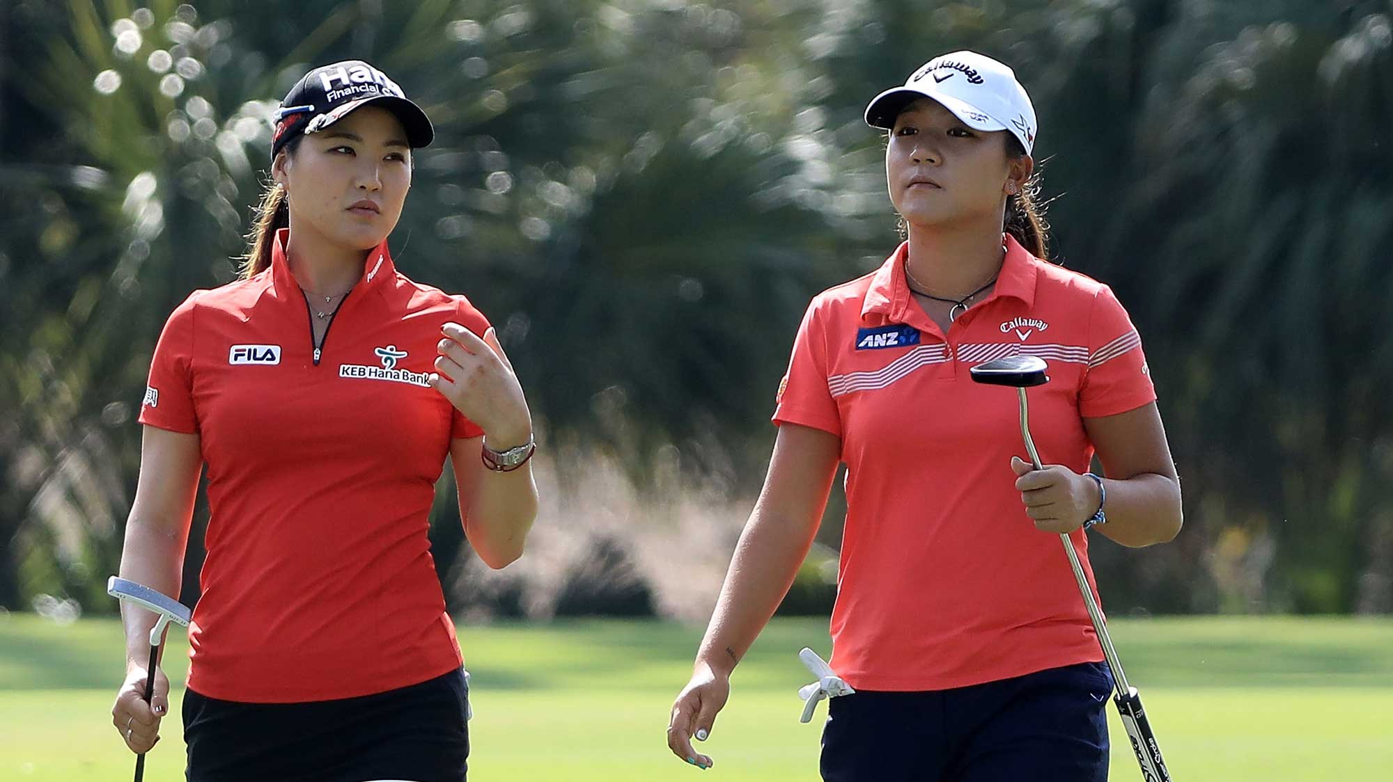 So Yeon Ryu of South Korea and Lydia Ko of New Zealand walk up the second fairway during the third round of the CME Group Tour Championship