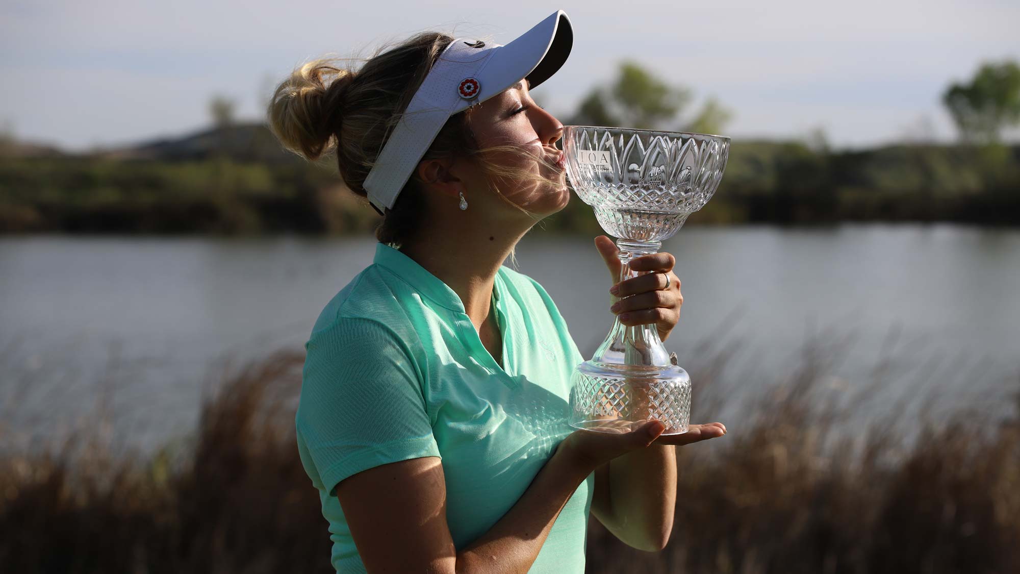 Jillian Hollis kisses IOA Championship trophy
