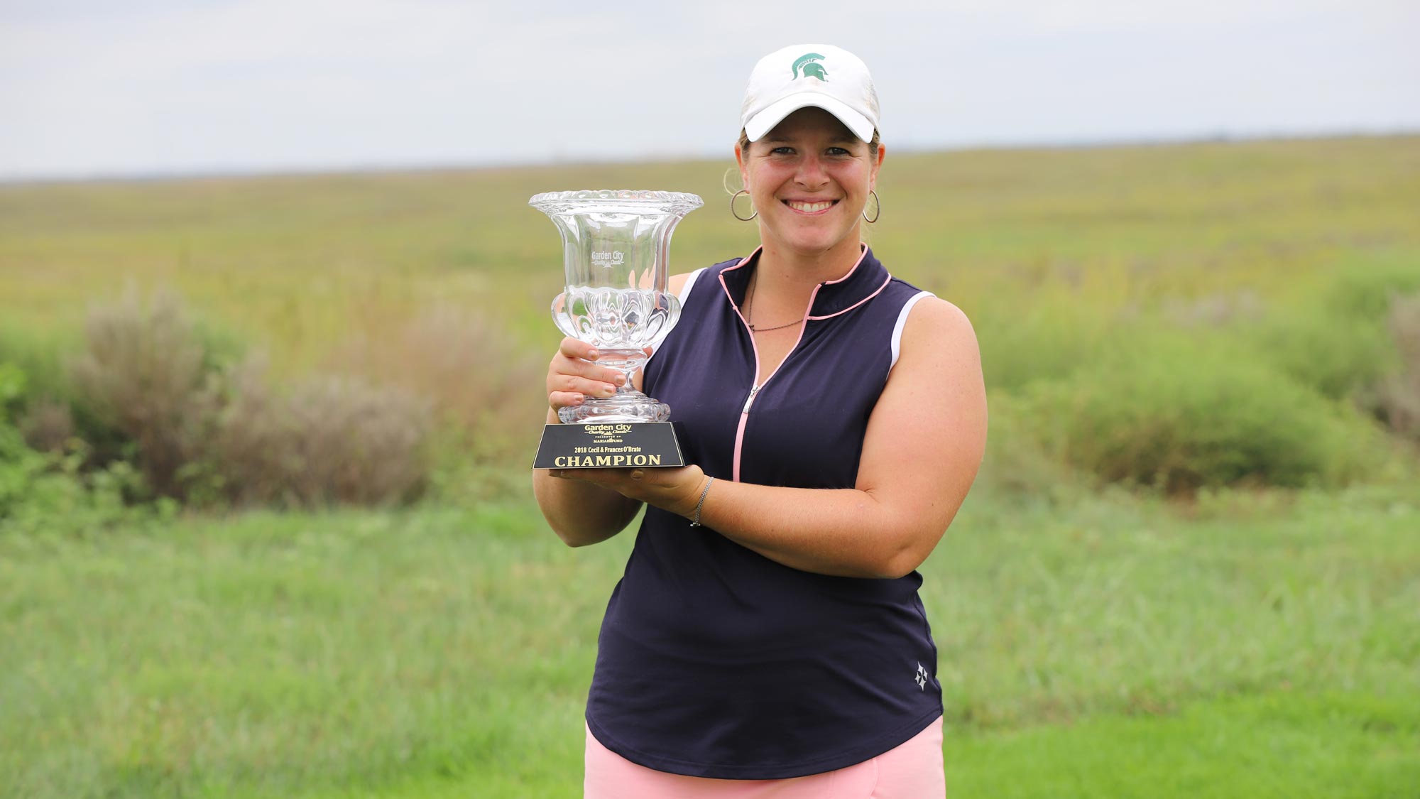 Allyssa Ferrel with the trophy at the Garden City Charity Classic