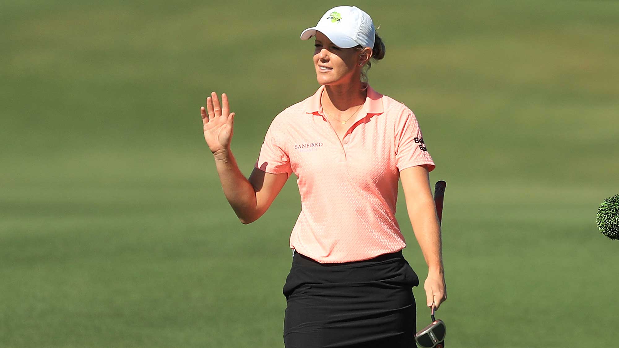 Amy Olson reacts as she walks up the 18th fairway during the first round of the CME Group Tour Championship
