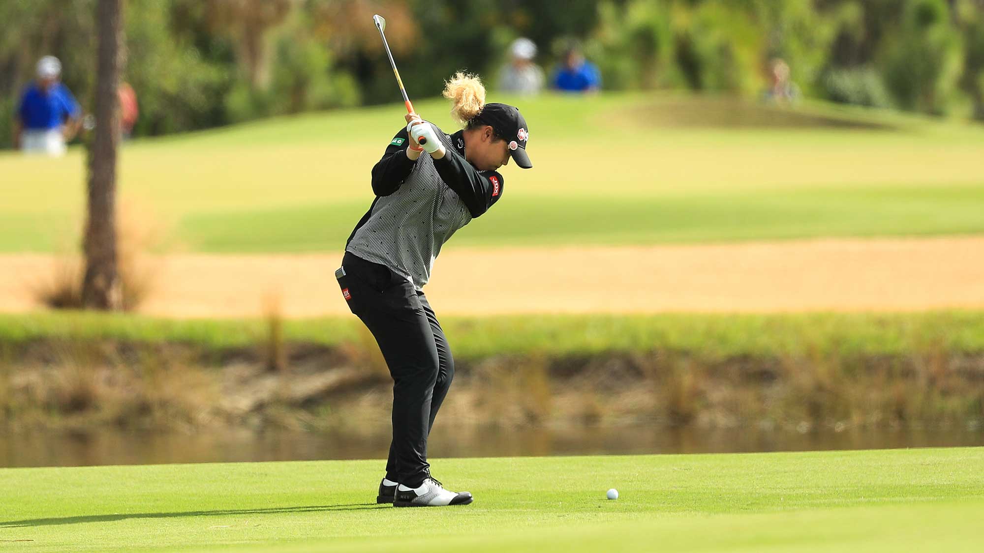 Ariya Jutanugarn of Thailand plays her third shot on the first hole during the final round of the LPGA CME Group Tour Championship